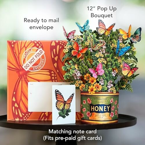 12-inch pop-up bouquet with butterflies, honey tin, envelope, and note card.