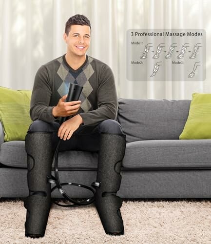 Man using leg massage device on a couch.