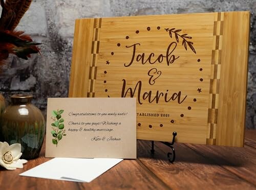 Personalized wooden sign with names Jacob and Maria and a greeting card.